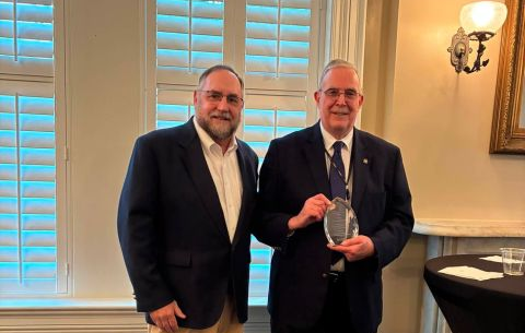 Dr. Penning (right) receiving award